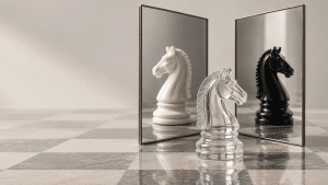 Chess piece (knight) reflected in a mirror as both black and white knights.